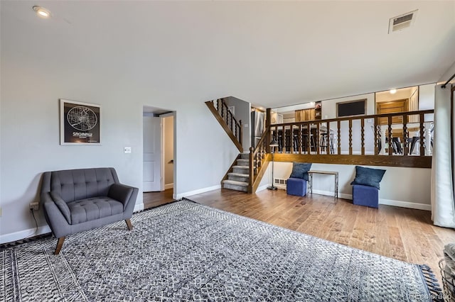 10397 Yates Ct, Westminster, CO 80031 - living area featuring stairs, wood finished floors, and baseboards