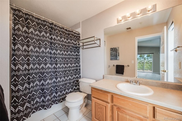 bathroom with a shower with shower curtain, tile patterned floors, a textured ceiling, vanity, and toilet