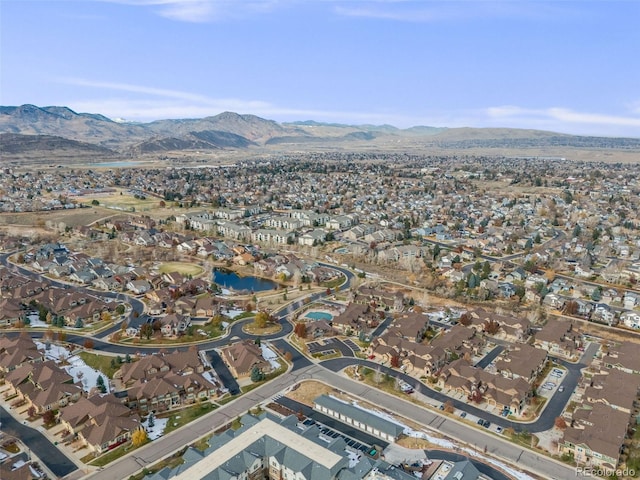 birds eye view of property with a mountain view