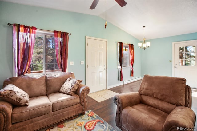 living room with baseboard heating, wood-type flooring, lofted ceiling, and plenty of natural light