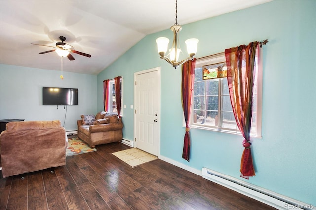 interior space featuring baseboard heating, lofted ceiling, hardwood / wood-style floors, and ceiling fan with notable chandelier