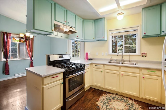 kitchen with gas range, baseboard heating, kitchen peninsula, sink, and dark hardwood / wood-style flooring