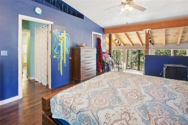 bedroom with ceiling fan, dark hardwood / wood-style flooring, and vaulted ceiling with beams