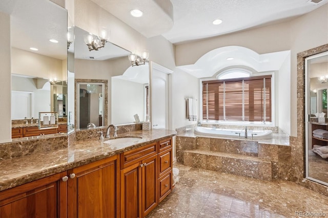 9065 E Lost Hill Trl, Lone Tree, CO 80124 - bathroom with a bath, vanity, and recessed lighting