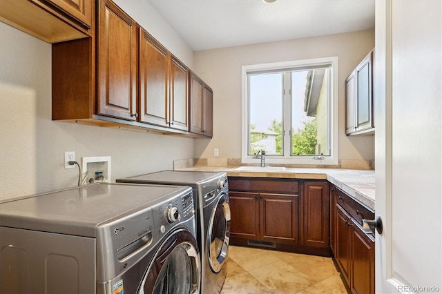 9065 E Lost Hill Trl, Lone Tree, CO 80124 - washroom with independent washer and dryer, cabinet space, and light tile patterned floors