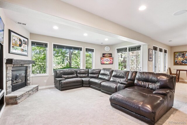 9065 E Lost Hill Trl, Lone Tree, CO 80124 - living area with carpet, recessed lighting, and a stone fireplace