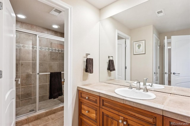 9065 E Lost Hill Trl, Lone Tree, CO 80124 - full bathroom featuring vanity, a shower stall, and tile patterned floors