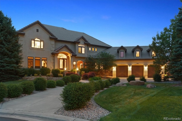 9065 E Lost Hill Trl, Lone Tree, CO 80124 - view of front facade featuring a front lawn and stucco siding