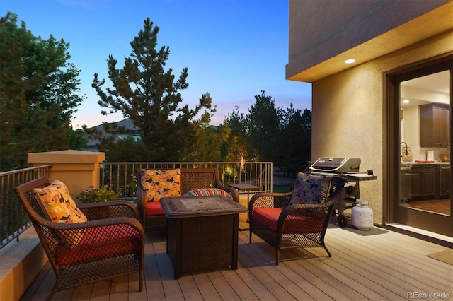9065 E Lost Hill Trl, Lone Tree, CO 80124 - deck at dusk with a grill and outdoor lounge area