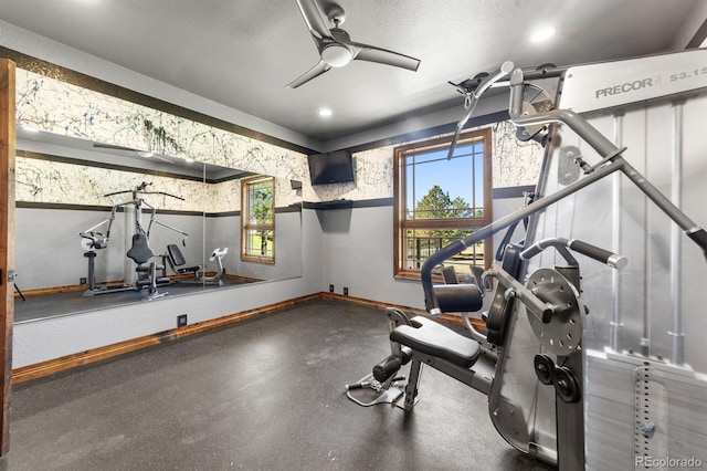 workout area featuring ceiling fan and a textured ceiling