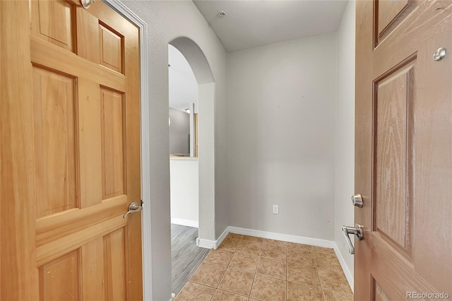 5220 Boardwalk Dr Unit A14, Fort Collins, CO 80525 - corridor with arched walkways and light tile patterned flooring