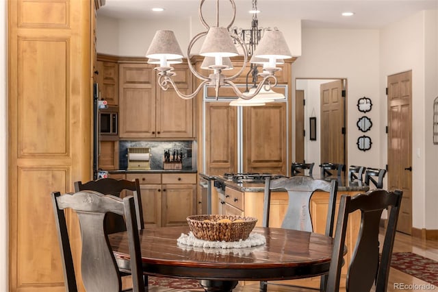 22554 Treetop Ln, Golden, CO 80401 - dining area featuring a chandelier and recessed lighting