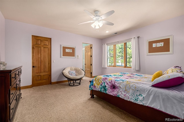 22554 Treetop Ln, Golden, CO 80401 - bedroom with light colored carpet, baseboards, and ceiling fan
