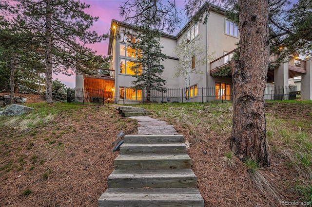 22554 Treetop Ln, Golden, CO 80401 - view of front facade featuring stucco siding and stairway
