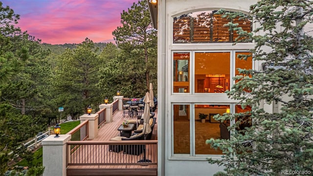 22554 Treetop Ln, Golden, CO 80401 - view of deck at dusk
