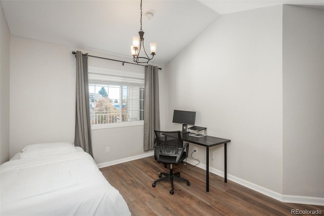 bedroom featuring dark hardwood / wood-style flooring, a chandelier, and vaulted ceiling