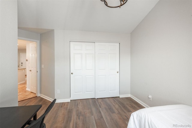 bedroom featuring a closet and dark hardwood / wood-style floors