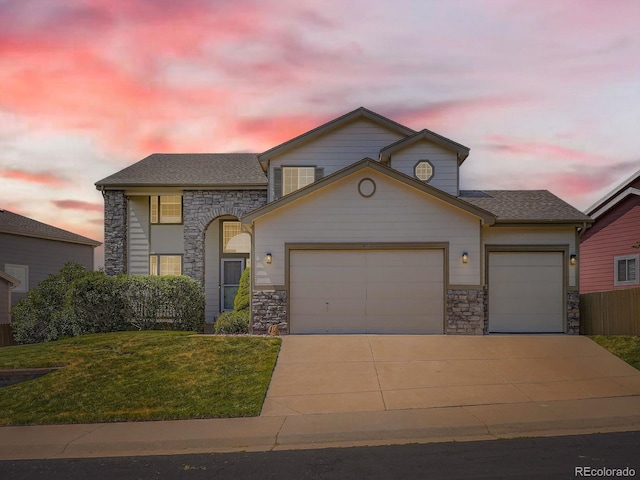 21770 Mount Elbert Pl, Parker, CO 80138 - view of front facade with stone siding, an attached garage, driveway, and a yard