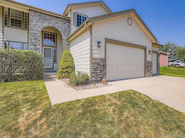21770 Mount Elbert Pl, Parker, CO 80138 - view of front facade featuring stone siding, an attached garage, driveway, and a front lawn