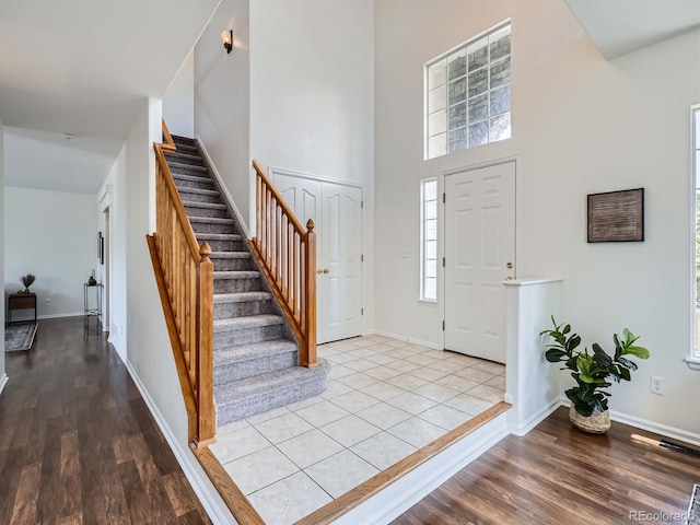 21770 Mount Elbert Pl, Parker, CO 80138 - entryway with stairs, wood finished floors, and a towering ceiling