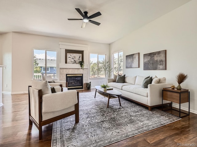21770 Mount Elbert Pl, Parker, CO 80138 - living area with a tile fireplace, ceiling fan, and wood finished floors