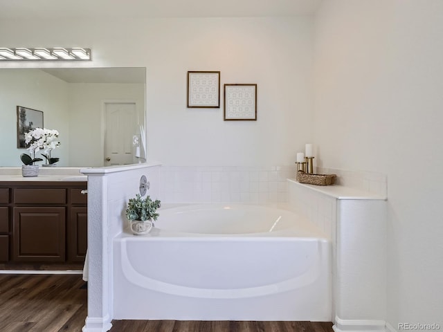 21770 Mount Elbert Pl, Parker, CO 80138 - bathroom featuring wood finished floors, a bath, and vanity