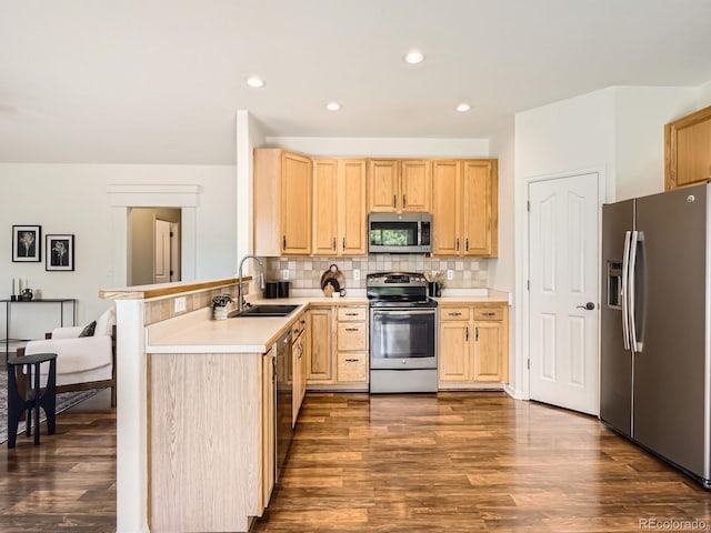 21770 Mount Elbert Pl, Parker, CO 80138 - kitchen featuring appliances with stainless steel finishes, light brown cabinets, dark wood-style floors, decorative backsplash, and light countertops