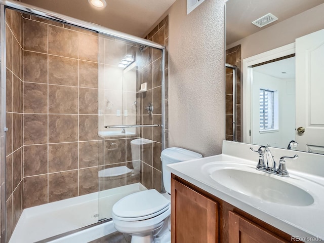 21770 Mount Elbert Pl, Parker, CO 80138 - bathroom with a textured wall, vanity, and a stall shower