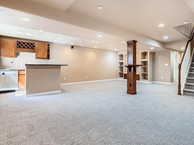 21770 Mount Elbert Pl, Parker, CO 80138 - finished basement featuring light carpet, stairs, bar with sink, recessed lighting, and built in shelves
