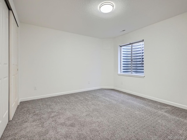 21770 Mount Elbert Pl, Parker, CO 80138 - unfurnished bedroom with carpet, a closet, and a textured ceiling