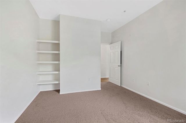 unfurnished bedroom with baseboards and carpet floors