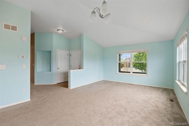 4732 S Coolidge St, Aurora, CO 80016 - carpeted empty room with vaulted ceiling and a chandelier