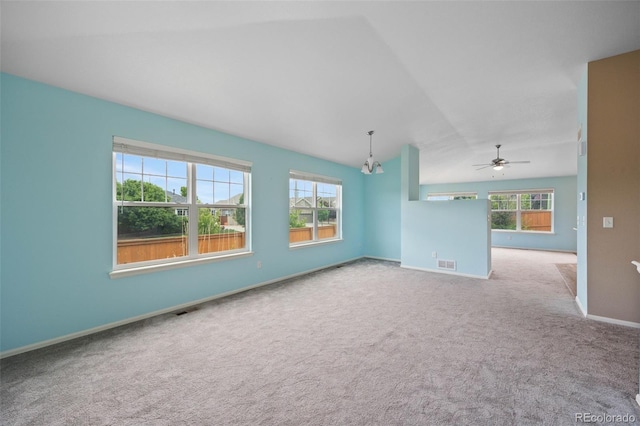 4732 S Coolidge St, Aurora, CO 80016 - spare room with vaulted ceiling, carpet flooring, healthy amount of natural light, a ceiling fan, and a chandelier