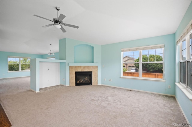 4732 S Coolidge St, Aurora, CO 80016 - unfurnished living room featuring vaulted ceiling, carpet flooring, a fireplace, and ceiling fan