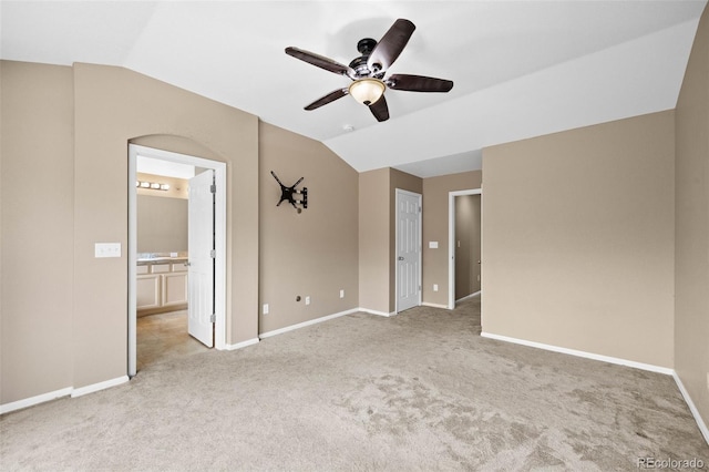 4732 S Coolidge St, Aurora, CO 80016 - unfurnished bedroom featuring vaulted ceiling, light colored carpet, ensuite bath, and ceiling fan