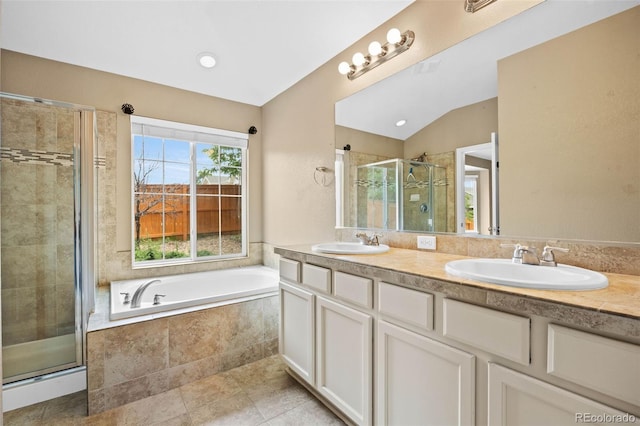 4732 S Coolidge St, Aurora, CO 80016 - full bathroom with a shower stall, a garden tub, double vanity, tile patterned floors, and lofted ceiling