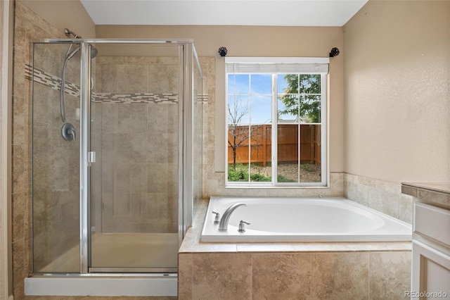 4732 S Coolidge St, Aurora, CO 80016 - full bathroom with plenty of natural light, a garden tub, and a stall shower