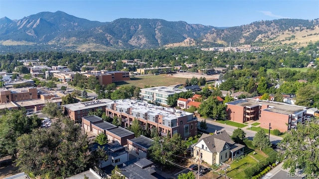 birds eye view of property with a mountain view