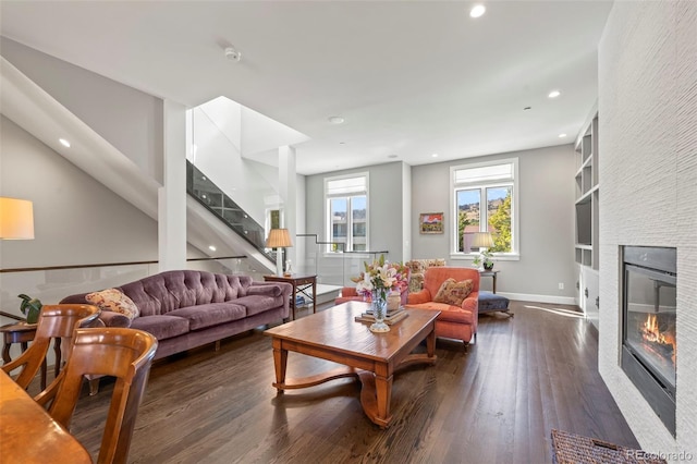 living room with dark hardwood / wood-style floors