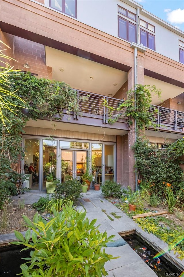 rear view of house with a balcony