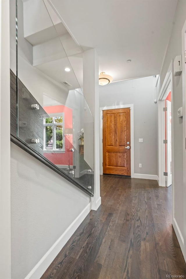 entrance foyer featuring dark hardwood / wood-style floors