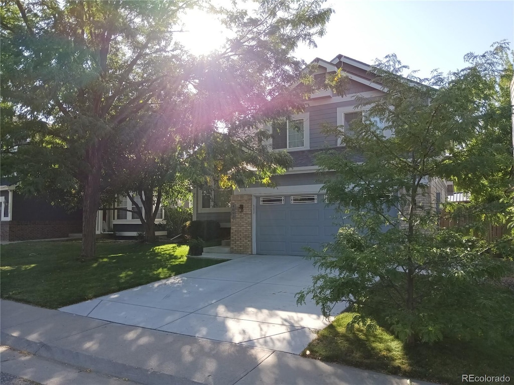 view of front facade with a garage and a front yard