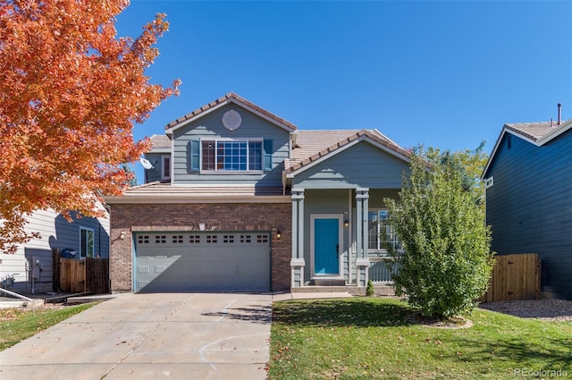 view of front of home with a front lawn and a garage