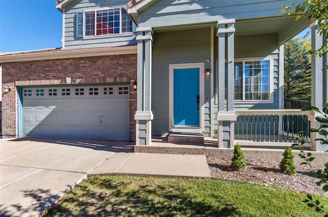 view of front facade featuring a garage and a porch