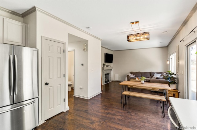 interior space with ornamental molding and dark hardwood / wood-style floors