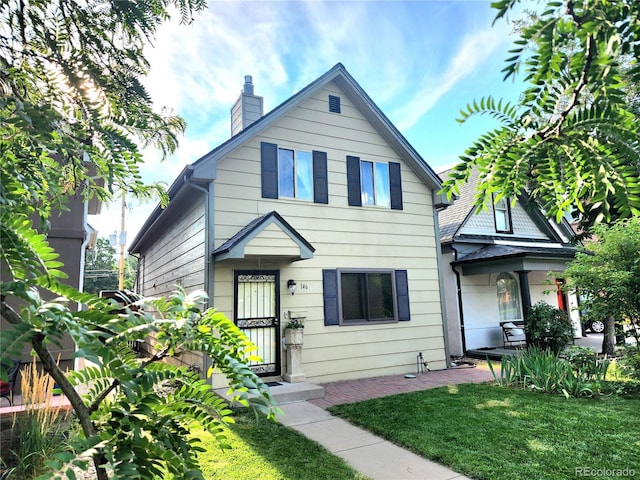 view of front of house with a front lawn