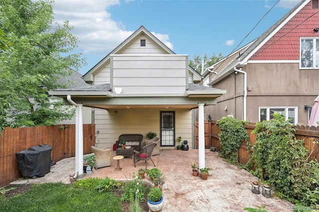 rear view of property with a patio