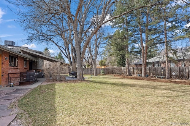 view of yard featuring a patio and fence