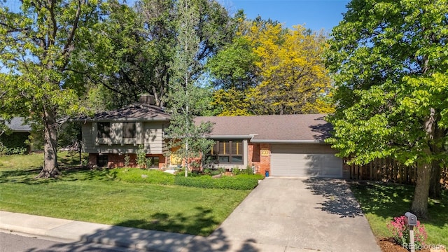 255 Kiowa Pl, Boulder, CO 80303 - tri-level home with an attached garage, driveway, a front yard, and brick siding