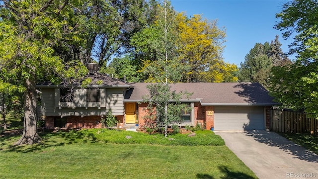 255 Kiowa Pl, Boulder, CO 80303 - split level home with a garage, driveway, and brick siding